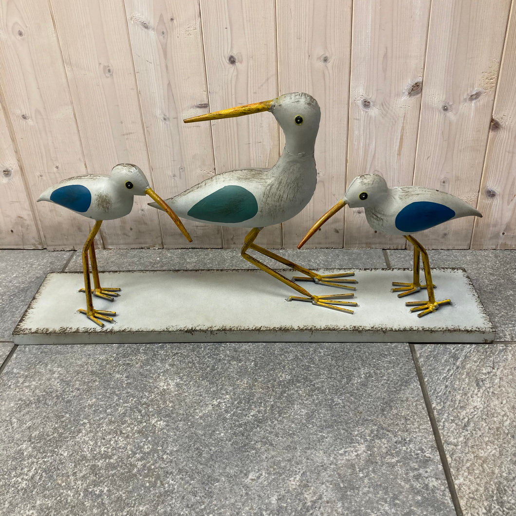 Birds on a plinth